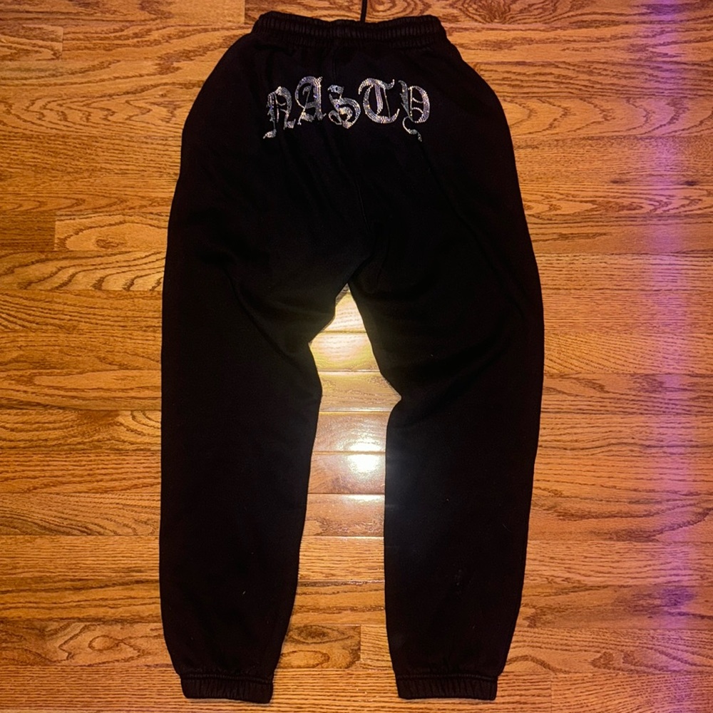Hidden Cult black “nasty” rhinestone sweatpants